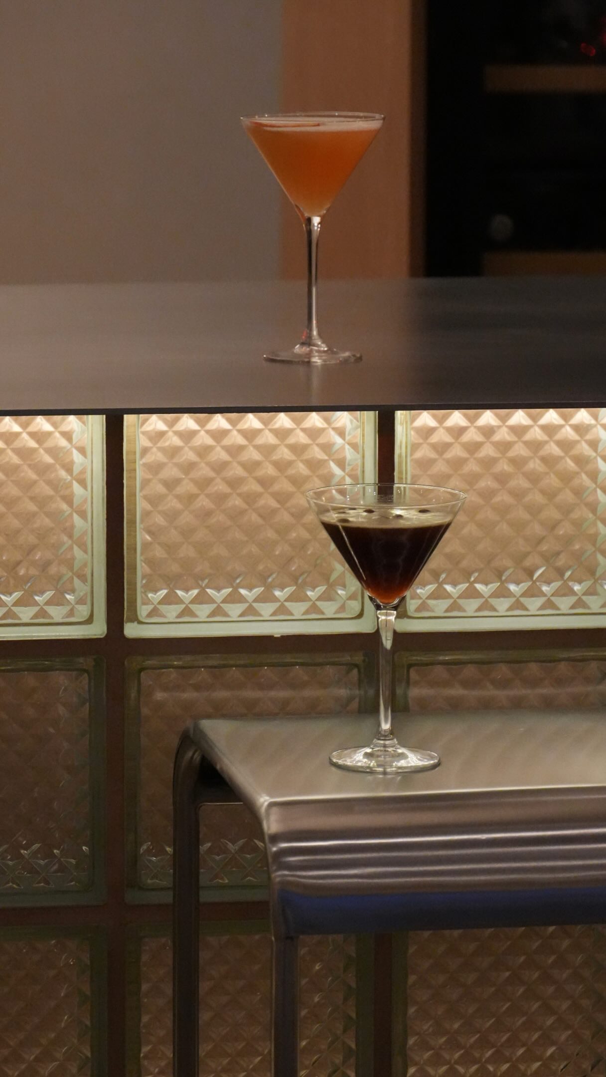 Evening cocktails on the backlit bar